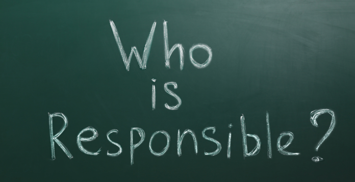 Words who is responsible written on a chalkboard
